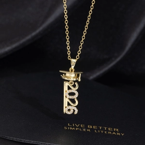 Elegant 2026 graduation cap necklace in gold finish with sparkling white crystals