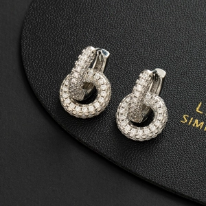 Elegant silver interlocking circle earrings with pavé zircons on black leather