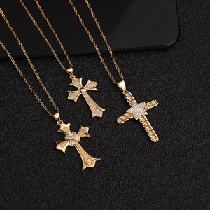 Three gold-plated cross pendant necklaces with micro-pave cubic zirconia on black leather