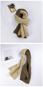 Detail of two-tone beige and coffee chunky knit scarf with thick ribbed texture