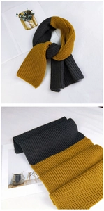 Close-up of thick grey and ginger yellow knit scarf with textured chunky weave details