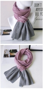 Close-up of dual-tone knit scarf showing soft purple and grey thick yarn texture