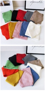 Multiple colors of chunky knit neck warmer scarves with ribbed texture detail