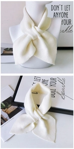 Detailed knit texture and wrap-around style of a cozy cream thick knitted scarf