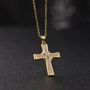 Gold plated cross pendant necklace with micro-paved cubic zirconia on a gold link chain