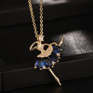 Ciondolo ballerina dorato con cristalli di zircone blu e pietre bianche