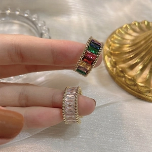 Adjustable gold plated open ring featuring colorful rainbow zircon and beaded edge detail