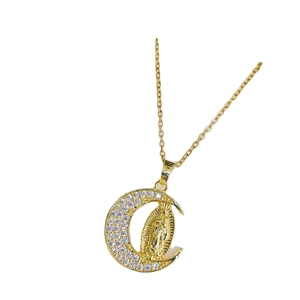 Golden crescent moon necklace with Guadalupe pendant and micro-paved cubic zirconia stones