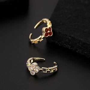 Adjustable gold plated four-leaf clover rings with red and white cubic zirconia accents