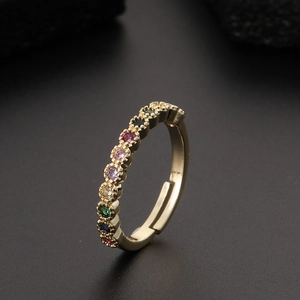 Detailed view of colorful zircon star rainbow ring with adjustable gold plated band