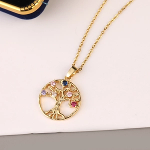 Detailed close-up of tree of life pendant with colorful zircon stones on gold chain