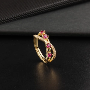 18K gold plated double layer twisted ring with red zircon stones on black leather base