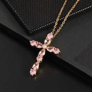 Cross necklace with pear-shaped pink cubic zirconia in gold plated setting