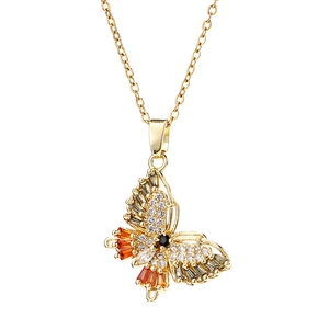 Collier papillon doré avec zircons orange et pierre noire centrale de précision