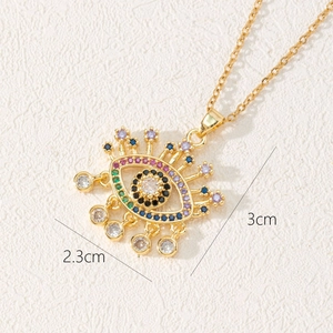 Bohemian gold evil eye necklace with colorful zircons and five dangling crystal charms