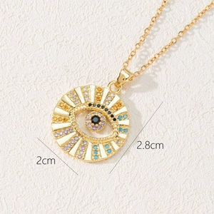 Close-up of bohemian evil eye pendant with colorful zircon stones and size dimensions