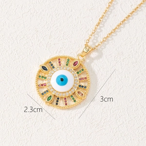 Detailed view of bohemian evil eye pendant showing dimensions 2.3cm by 3cm with zircons