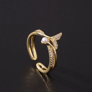 Detailed close-up of adjustable fishtail pearl ring with white zircon and gold plating