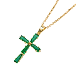 Classic gold cross necklace featuring rectangle green zirconia stones on a white background