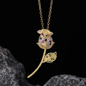 Detail of 18k gold plated rose pendant necklace with colorful cubic zirconia stones