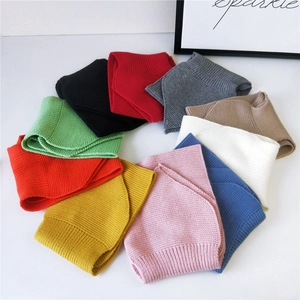 Thick knitted solid color crossover scarf in multiple colors for winter warmth