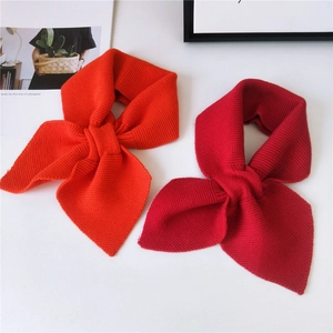 Thick knitted solid color crossover scarves in orange and deep red for winter warmth