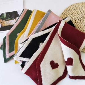 Long knitted heart pattern scarf with pointed edges in multiple autumn colors