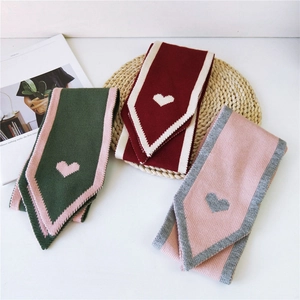Knitted winter scarves with heart patterns in green, burgundy, and pink variants