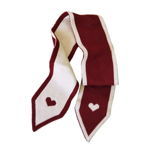 Knitted heart pattern scarf in red and white color block style for winter warmth