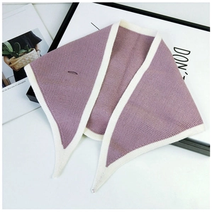 Detail of lavender knit triangle scarf with cream trim and buttonhole closure