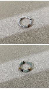 Detail van 4mm natuursteen elastische kralenringen in marmer en veelkleurige stijlen
