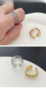 Detail of bohemian open ring featuring triple-layer beaded edges and colorful stones