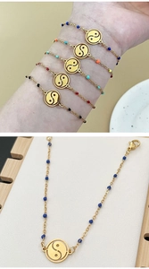 Detail of gold stainless steel Yin Yang bracelet with colorful beads and lobster clasp