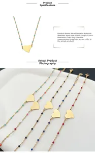 Detail of colorful stainless steel heart charms on a gold chain with 5cm extender
