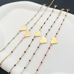 Set of five gold stainless steel heart bracelets with colorful enamel beads for women