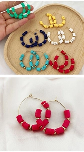 Detailed view of colorful bohemian polymer clay beaded hoop earrings in six vibrant colors