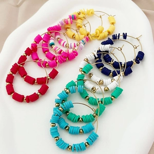 Bohemian rainbow heishi bead hoop earrings with colorful polymer clay and gold metal spacers