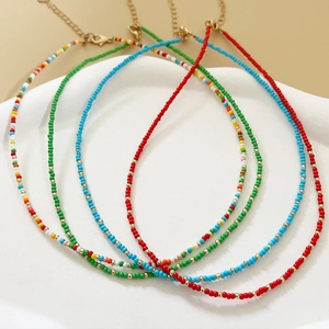 Set of four colorful handmade beaded necklaces with gold lobster clasps and extenders