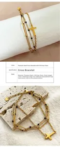 Detail of 18K gold plated titanium steel layered bracelet with cross and black beads