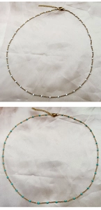 Macro detail of minimalist gold beaded chokers with white and turquoise enamel beads
