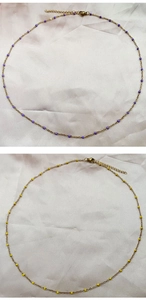 Detail of gold-plated stainless steel chain necklace with small purple and yellow beads