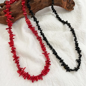 Vintage irregular natural stone beaded necklace in red and black on driftwood