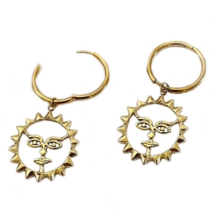 Golden sun face dangle earrings made of stainless steel with a vintage boho design style