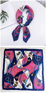 Detail of square silk scarf featuring luxury chain, belt, and tassel patterns in vibrant pink