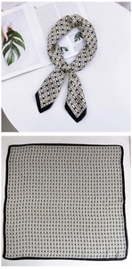 Detail of square silk scarf with geometric H pattern and black borders for professional wear