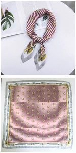 Detail of square silk scarf featuring red white stripes and gold chain print pattern