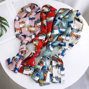 Set of four narrow silk scarves with cat prints in pink, red, green and ivory white