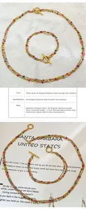 Close-up of 18K gold plated stainless steel multi-layer necklace with colorful enamel beads