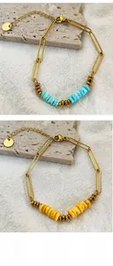 Detail of paperclip link bracelet with colorful stone beads in blue and yellow hues