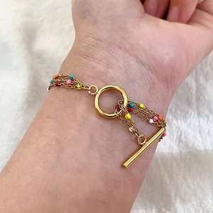 Layered 18K gold-plated stainless steel bracelet with colorful enamel beads and OT toggle clasp